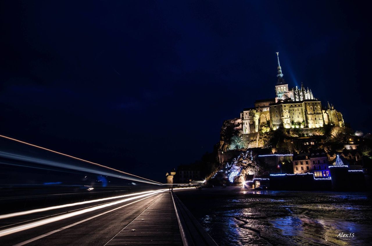 architecture, built structure, transportation, illuminated, night, building exterior, water, the way forward, bridge - man made structure, connection, city, mode of transport, river, diminishing perspective, sky, travel, travel destinations, vanishing point, long exposure, waterfront