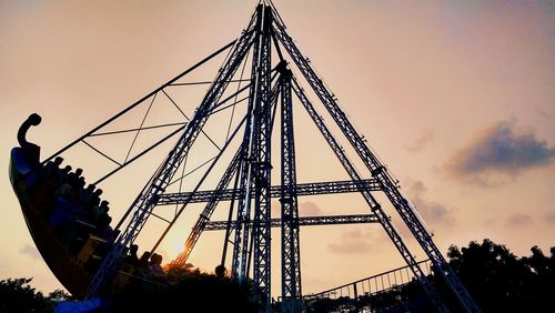 Low angle view of ferris wheel against sky