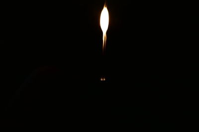 Low angle view of illuminated lights in the dark