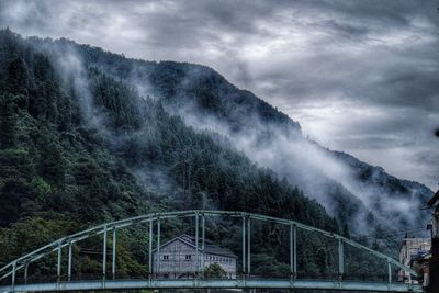 View of bridge against cloudy sky