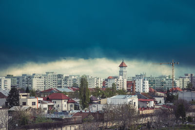 High angle view of buildings in city against sky