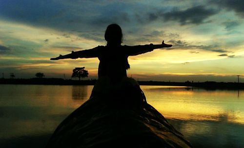 Silhouette of people at sunset