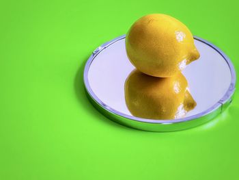 High angle view of lemon in plate on table