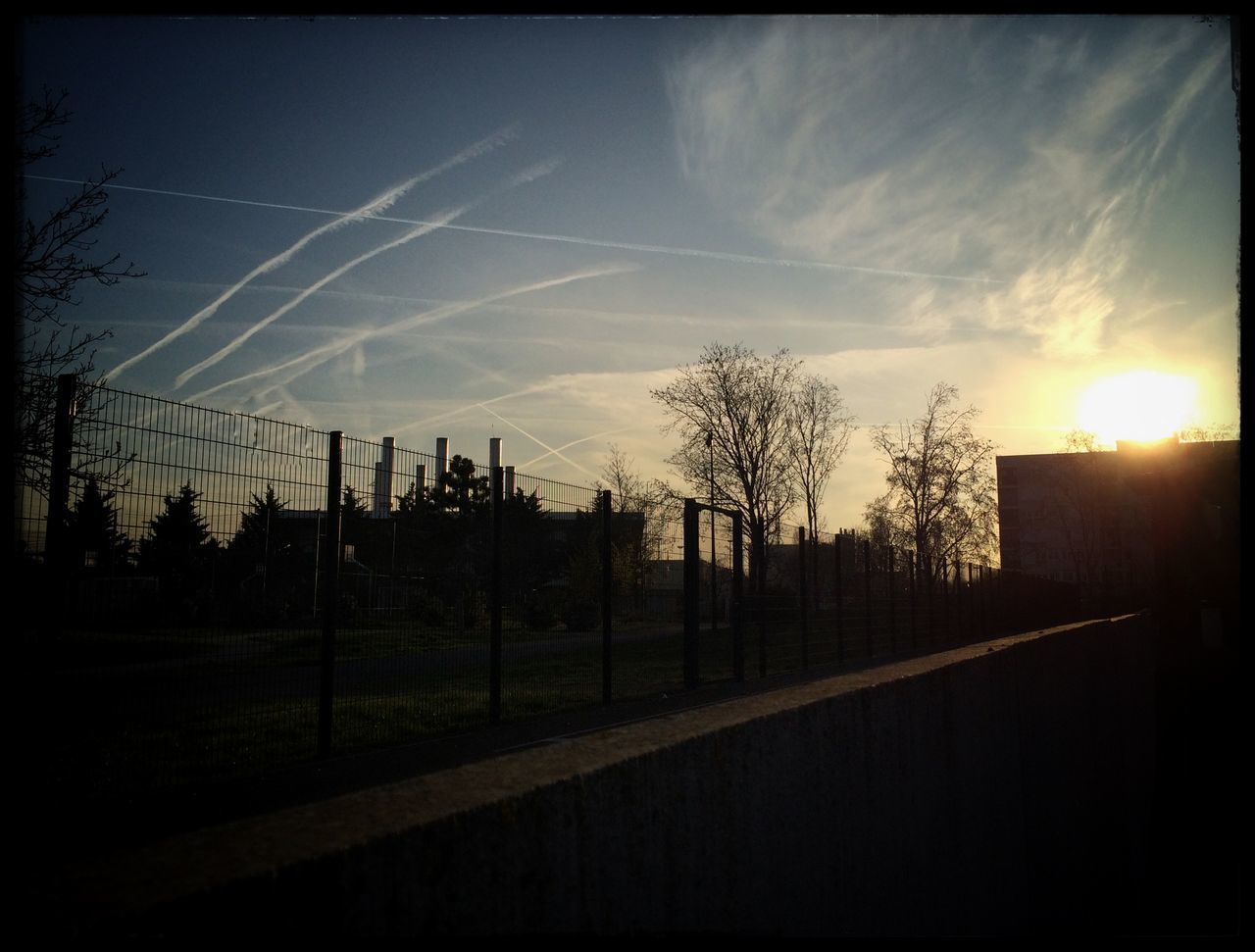 sunset, sun, sky, fence, sunlight, silhouette, landscape, field, sunbeam, transfer print, tranquility, tree, tranquil scene, nature, auto post production filter, scenics, cloud - sky, lens flare, beauty in nature, bare tree