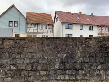 Low angle view of wall and buildings in rural village of thuringia, germany