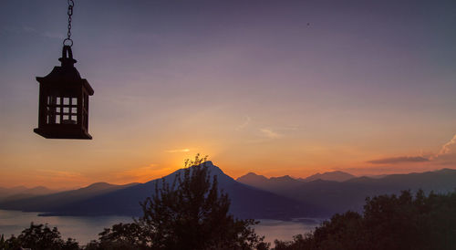 Scenic view of mountains against sky at sunset