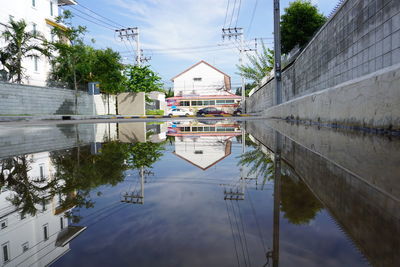 Reflection of buildings and trees in canal