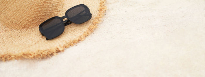 High angle view of sunglasses on snow