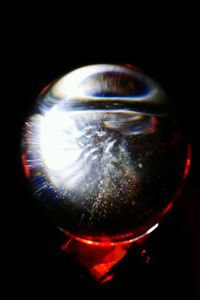 Close-up of light bulb over black background