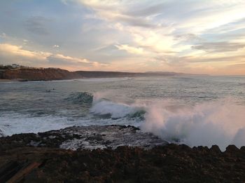 Scenic view of sea against dramatic sky