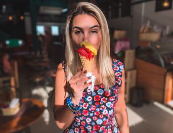 Portrait of woman eating ice cream