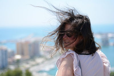 Rear view of woman with tousled hair