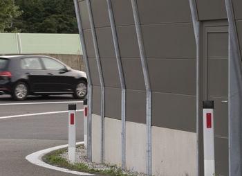 Cars parked on road by building