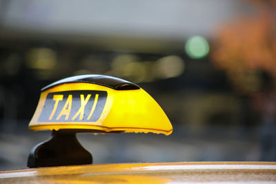 Close-up of yellow toy car on street