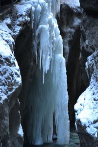 Snow covered rocks in water