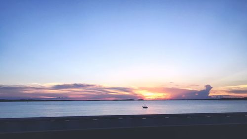 Scenic view of sea against sky at sunset