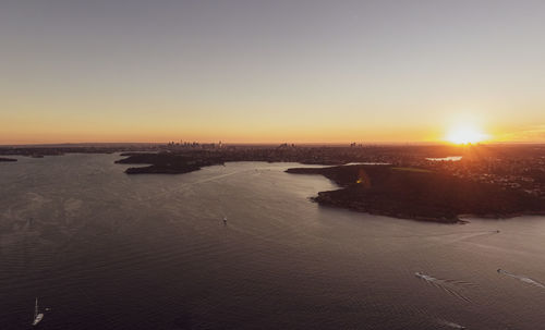 Scenic view of sea against clear sky during sunset