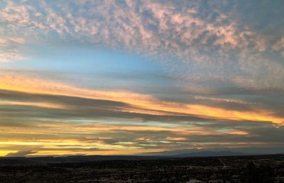 Scenic view of dramatic sky during sunset