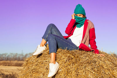 Outdoor atmospheric lifestyle photo of young beautiful lady with brown hair and eyes in pink coat