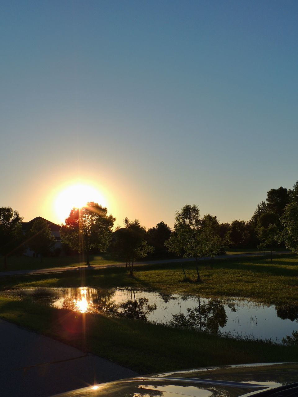 sun, clear sky, water, tranquil scene, reflection, tranquility, sunset, scenics, copy space, tree, beauty in nature, lake, sunlight, nature, lens flare, sunbeam, idyllic, river, blue, landscape