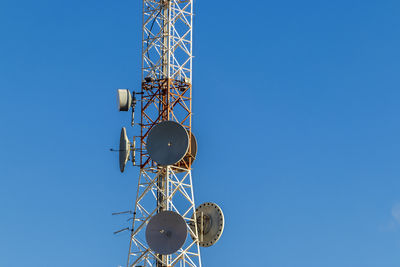 Telecommunication mast tv antennas wireless technology with cloudy blue sky in brazil