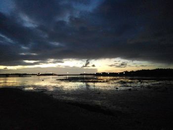 Scenic view of sea against cloudy sky