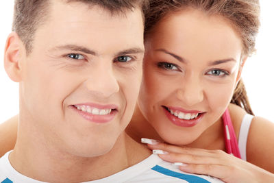Close-up portrait of a smiling young woman