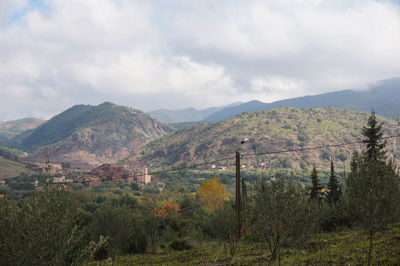 Scenic view of landscape and mountains against sky