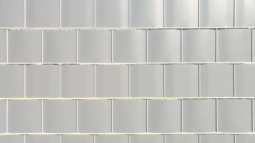 Full frame shot of gray tiled wall