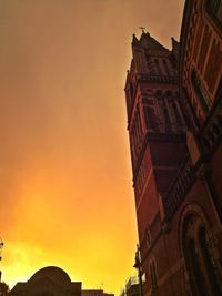 Low angle view of building against sky during sunset