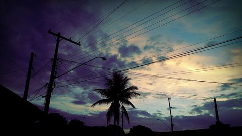 Low angle view of electricity pylon against sky