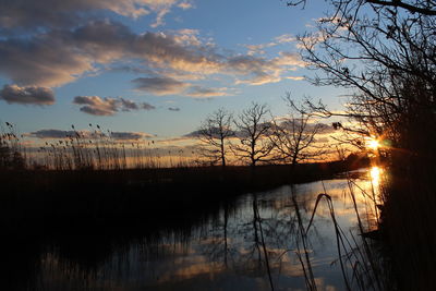 Scenic view of lake at sunset