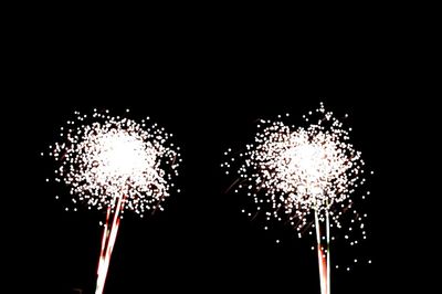Low angle view of illuminated lights at night