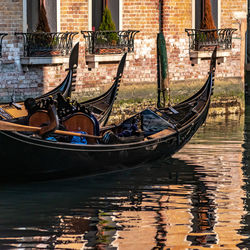 Gondolas moored in canal