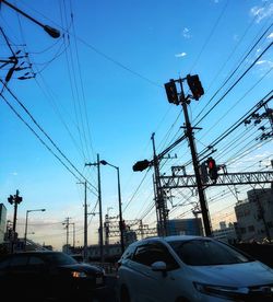 Cars on road against sky