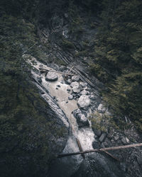 Aerial view of river flowing amidst valley