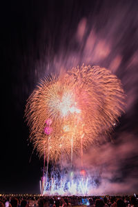 Firework display at night