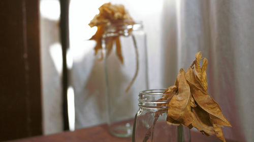 Close-up of glass vase on table at home