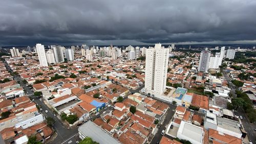 High angle view of buildings in city against sky