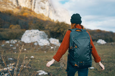 Rear view of man standing on land