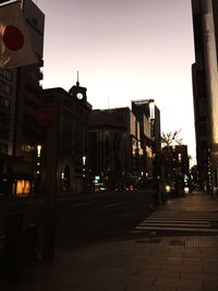 Illuminated buildings against sky at night