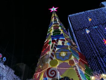 Low angle view of illuminated building at night
