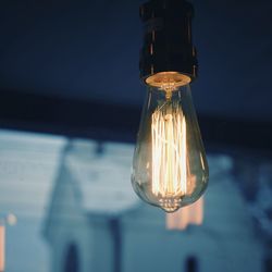 Close-up of light bulb hanging