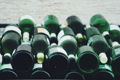 Full frame shot of wine bottles for sale in store