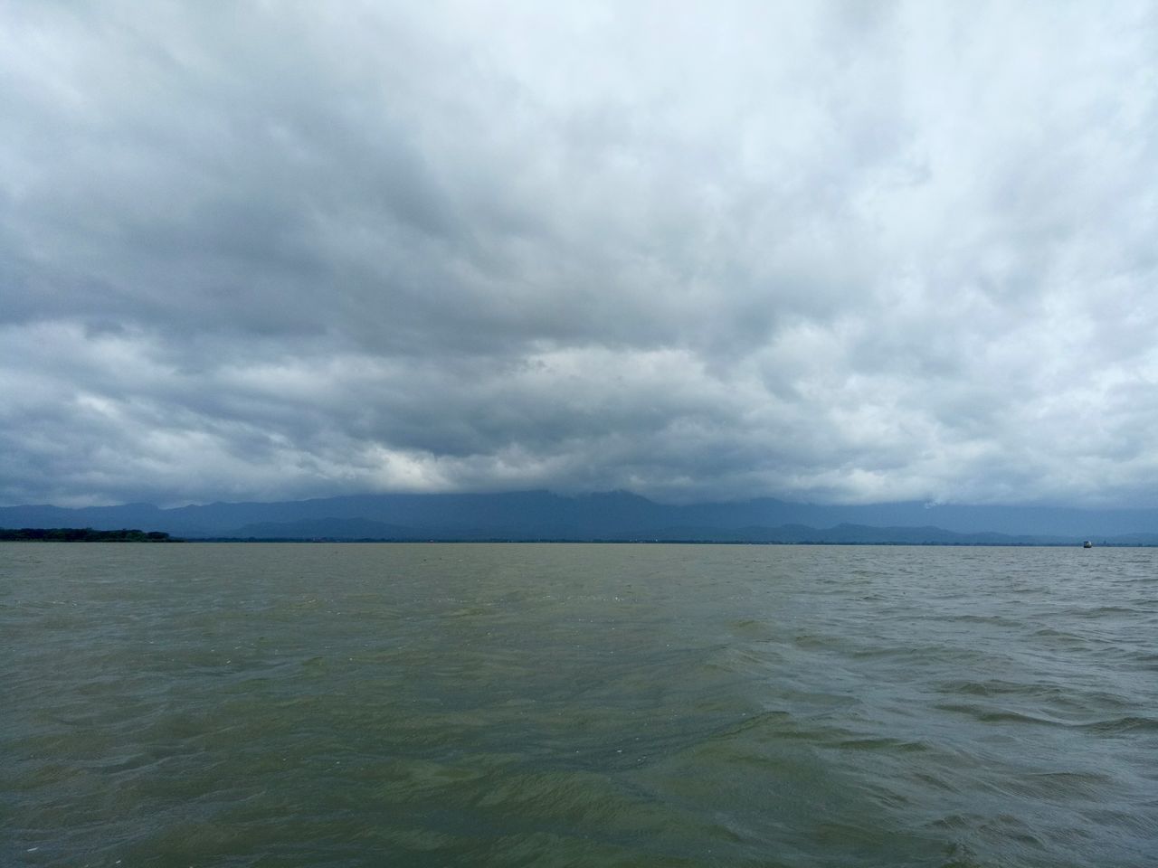 cloud - sky, sky, sea, water, scenics - nature, beauty in nature, tranquil scene, tranquility, no people, waterfront, horizon, nature, overcast, day, storm, horizon over water, non-urban scene, remote, outdoors, ominous