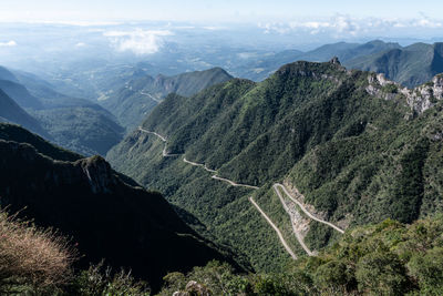 High angle view of land and mountains against sky