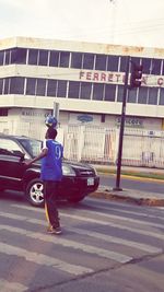 Woman walking on road