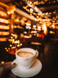 Coffee cup on table in cafe