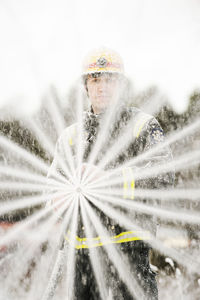 Fire fighter holding fire hose