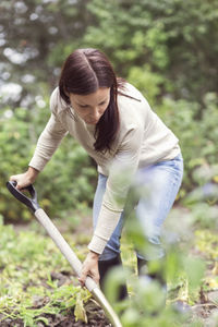 Mid adult woman working in organic farm